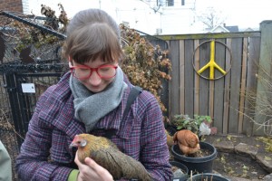 Kealy Holds a Hen at Chicken Run Rescue